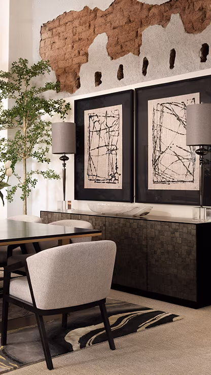 Dining room cabinet with artwork hung on wall
