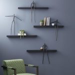 Moveable Man On Short Shelf , Sitting, A